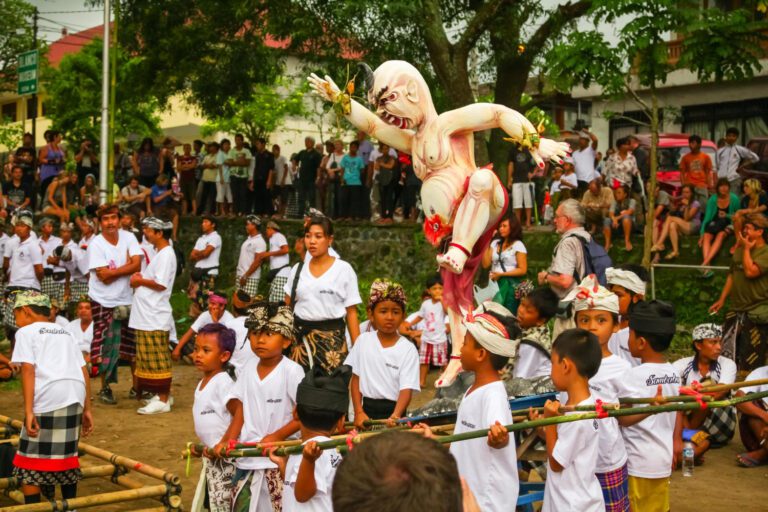 Traditional Balinese dance performance on an outdoor stage